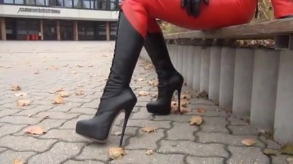 Red leather catsuit and 8 inch stilletoe boots