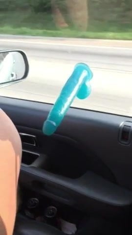 Woman Fucks Her Dildo In a Moving Car