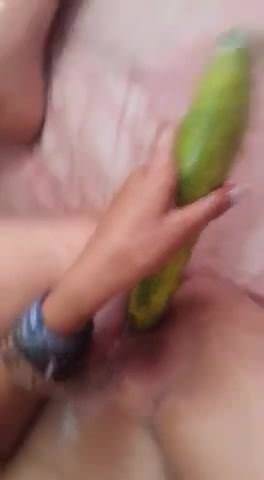 Coloured girl uses cucumber on tight pussy