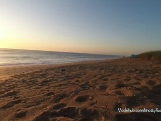 Masturbating on beach while being watched