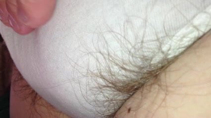 close up shot of long hairs escaping from white pantys,