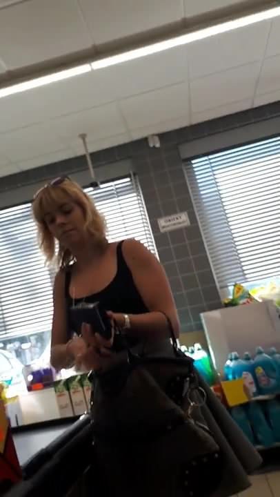 Upskirt in supermarket from the bottom 