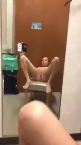 MILF gives herself a golden shower in the dressing room