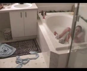 She masturbates with jet his bathtub.