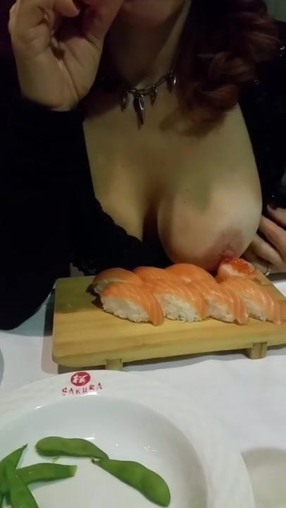 My wife in a sushi restaurant