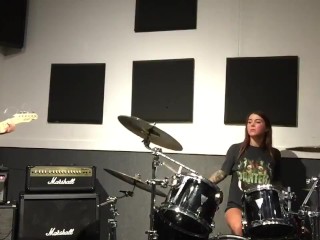 Felicity Feline drumming and plays some stoner rock behind the scenes