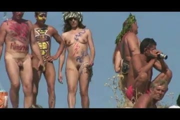 Girls with painted bodies in Russian nudist beach