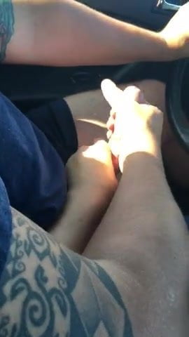 Driving hand job with cumshot