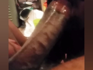 Sucking on a fat black cock