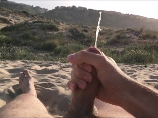 Masturbating on nudist beach. Slowmotion cumshot