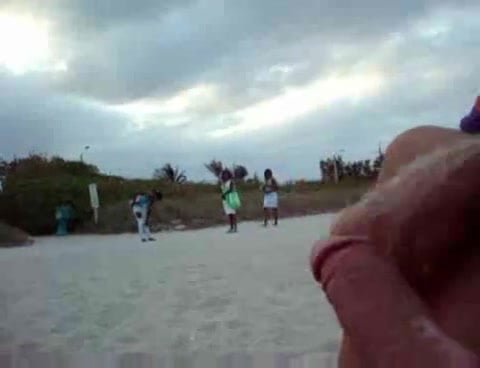 Wanking on the beach in front of black girls