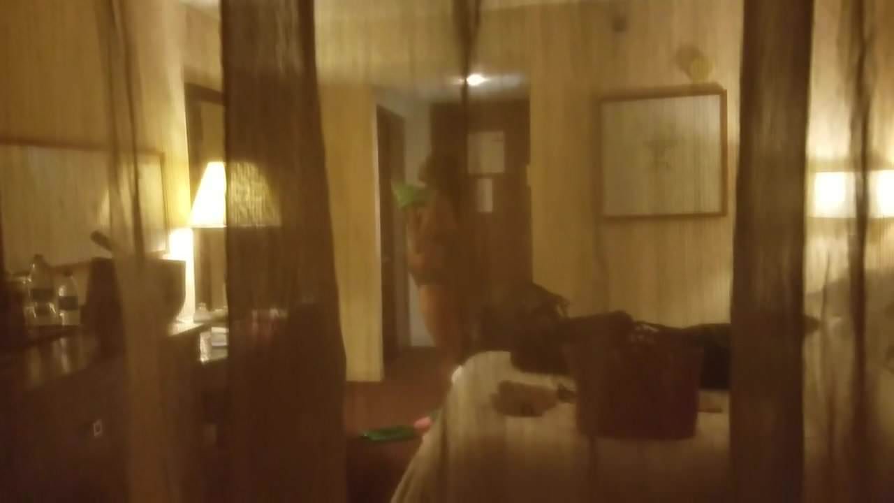Hot black women changing in hotel window 