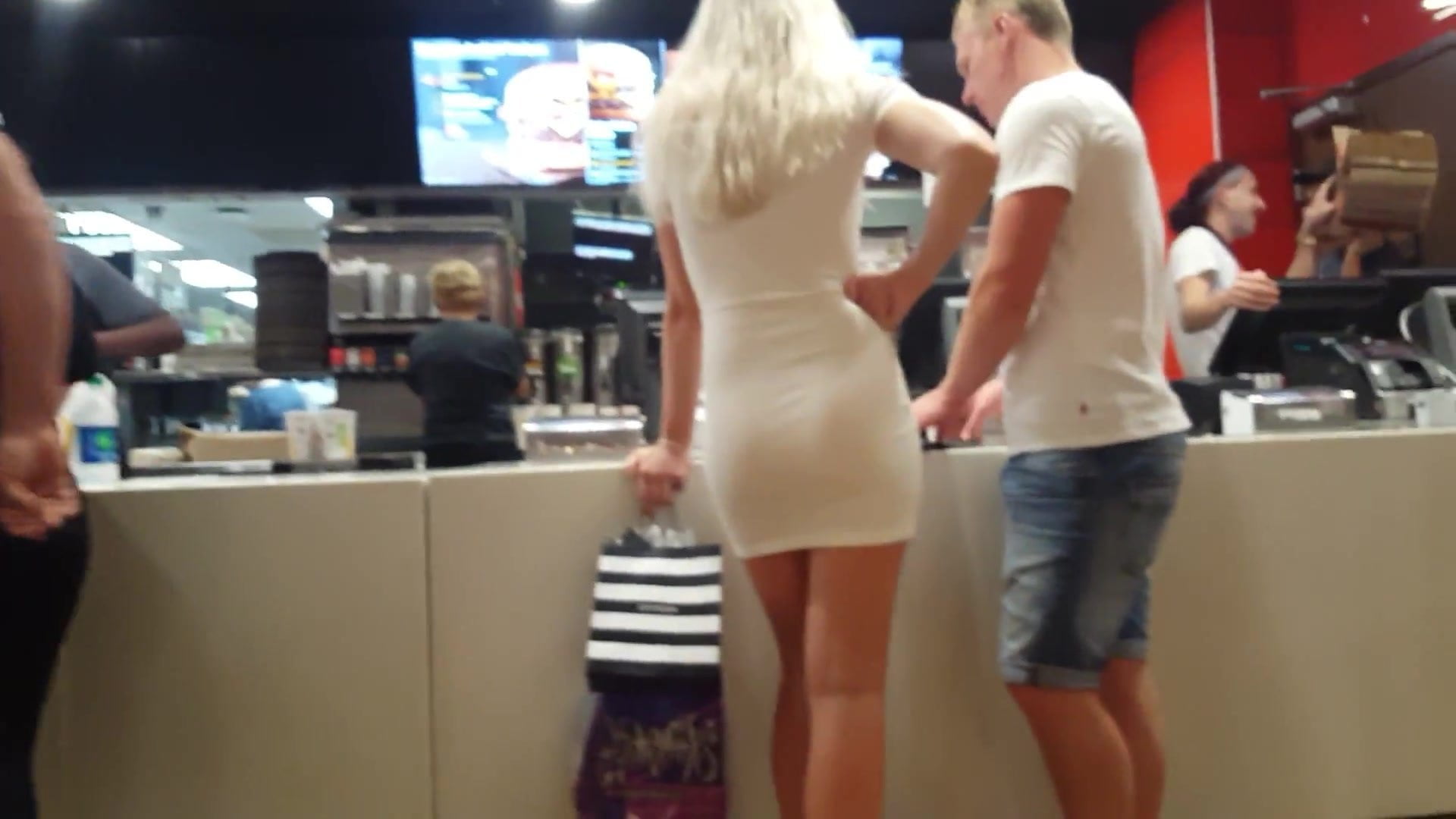 Candid voyeur hot blonde skin tight dress ordering food