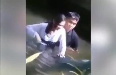 couple do romance in a river.mp4