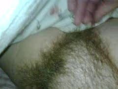 playing with her hairy bush and licking he stiff nipple.