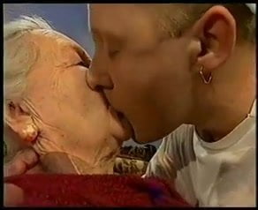 Very old lady gets kissed