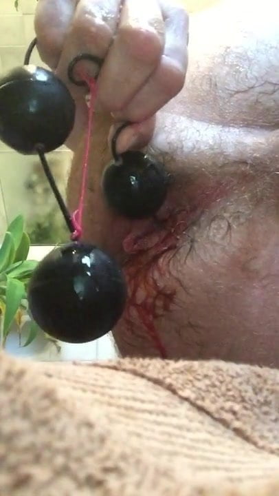 Sticking 6 huge anal beads up my huge gaping asshole