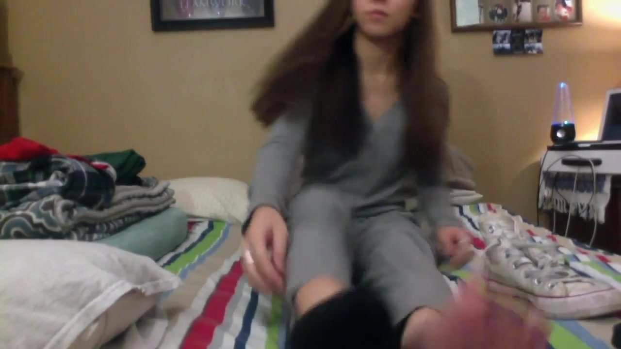 long haired teen shows feet