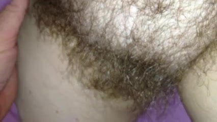 super close up of her shiny hairy bush.