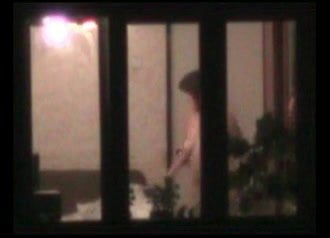 Naked woman in window