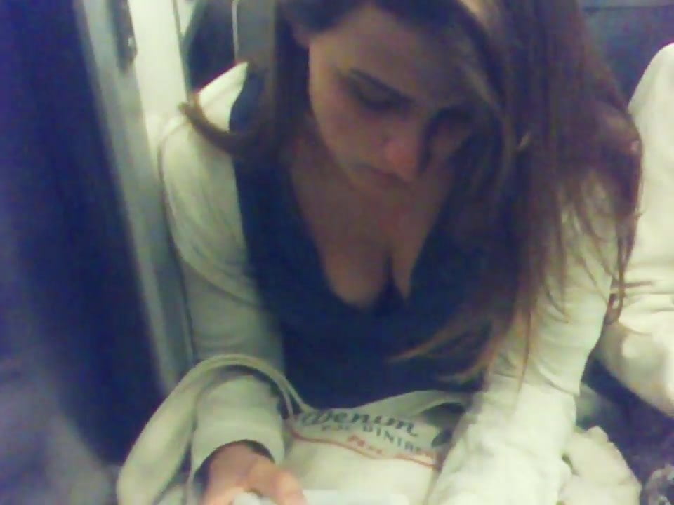cute young girl deep downblouse in Paris subway