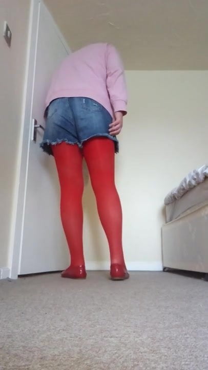 Crossdresser wearing red pantyhose 