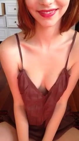 Sexy red head showing off her tits
