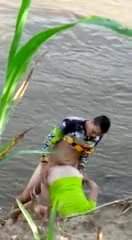 My nice and her boyfriend are fucking in the river.
