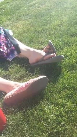Candid Feet in Flip Flops on the Lawn
