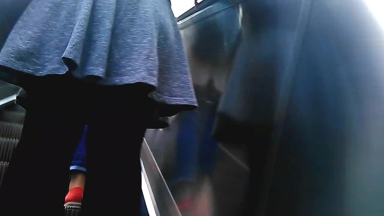 Upskirt on escalator 38