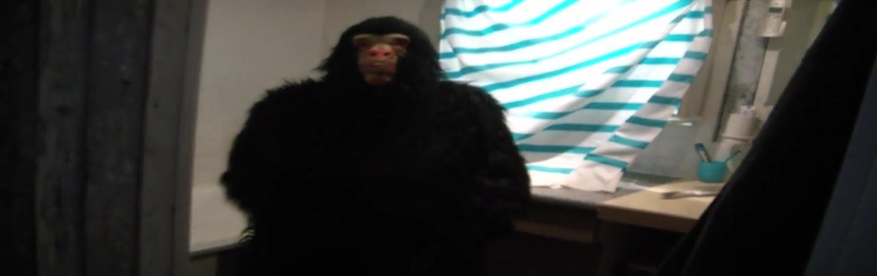 rubber guy wanking in monkey suit
