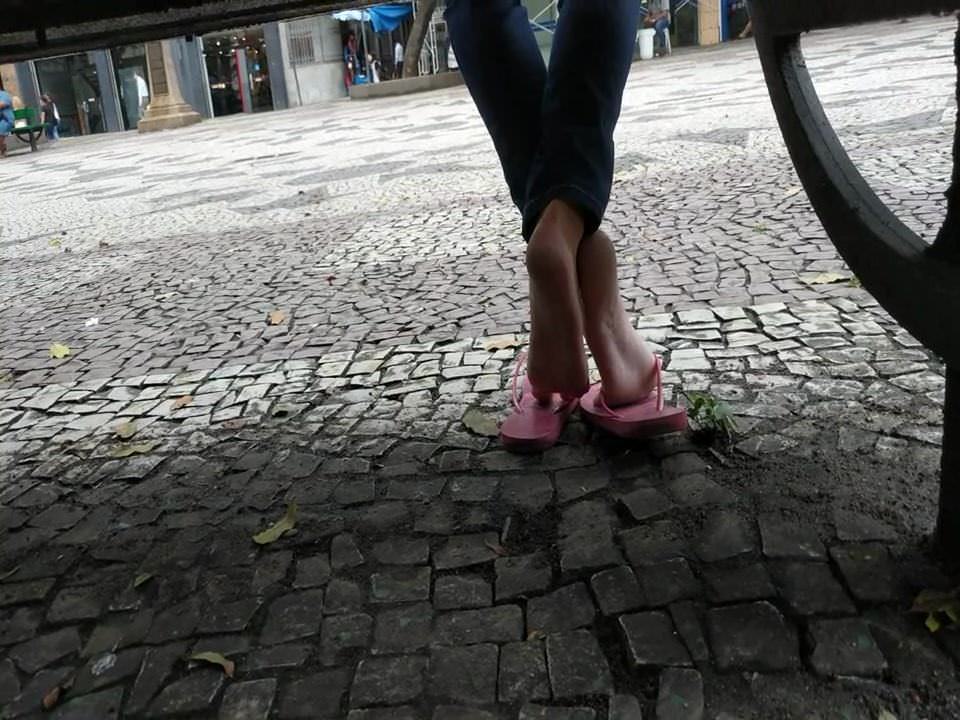 Candid girl feet and soft soles in public square