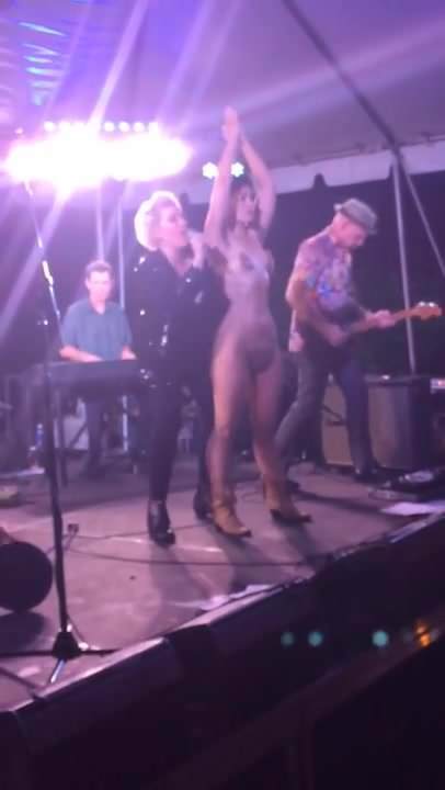 sexy nude girl in boots on public concert stage