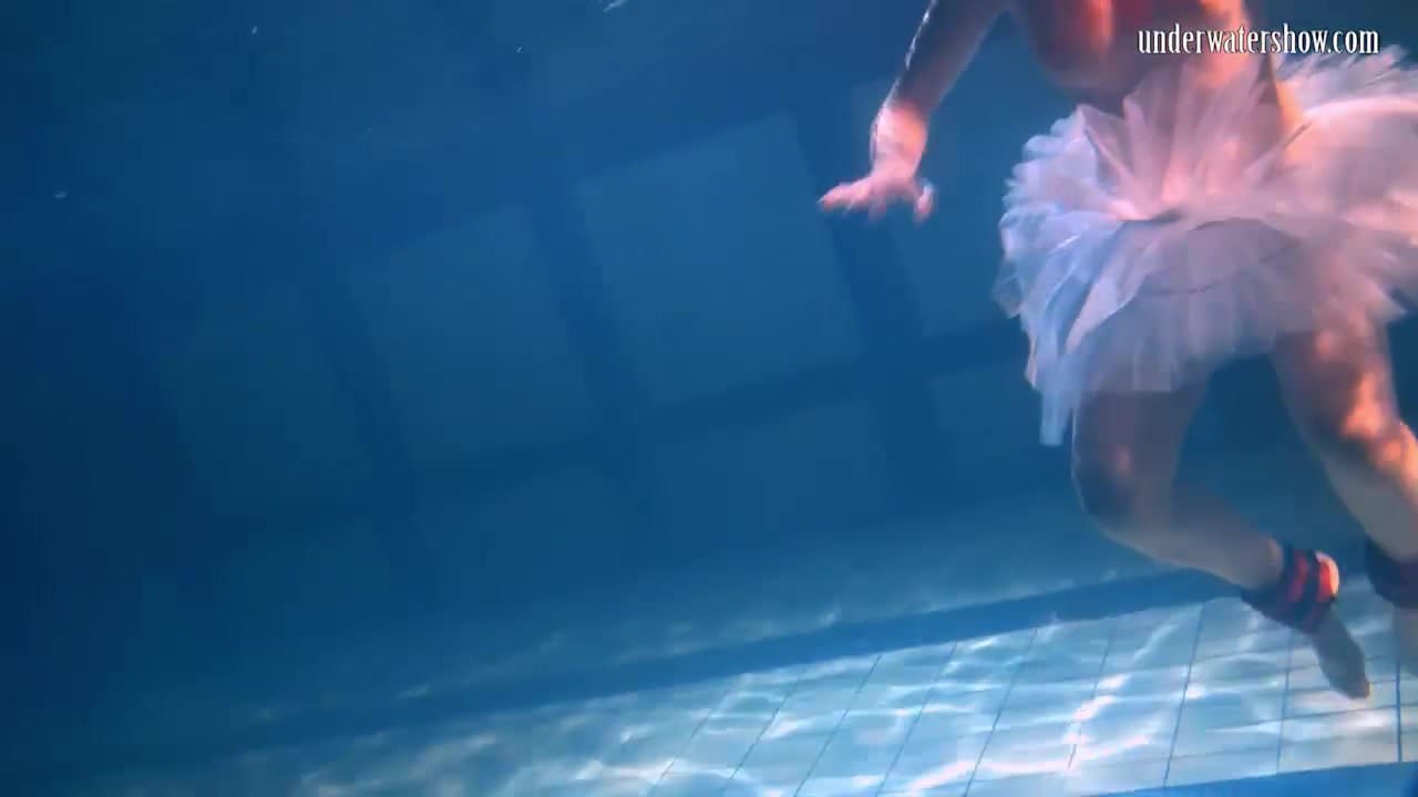  Bulava Lozhkova with a red tie and skirt underwater