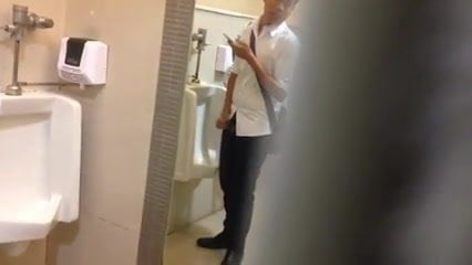 Caught man jerking at the urinals