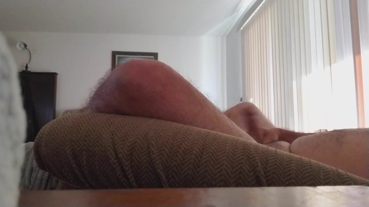 Guy  watching porn with cumshot