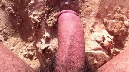 stroking the cock at the beach