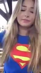 Trisha Annabelle smoking in superman outfit outside