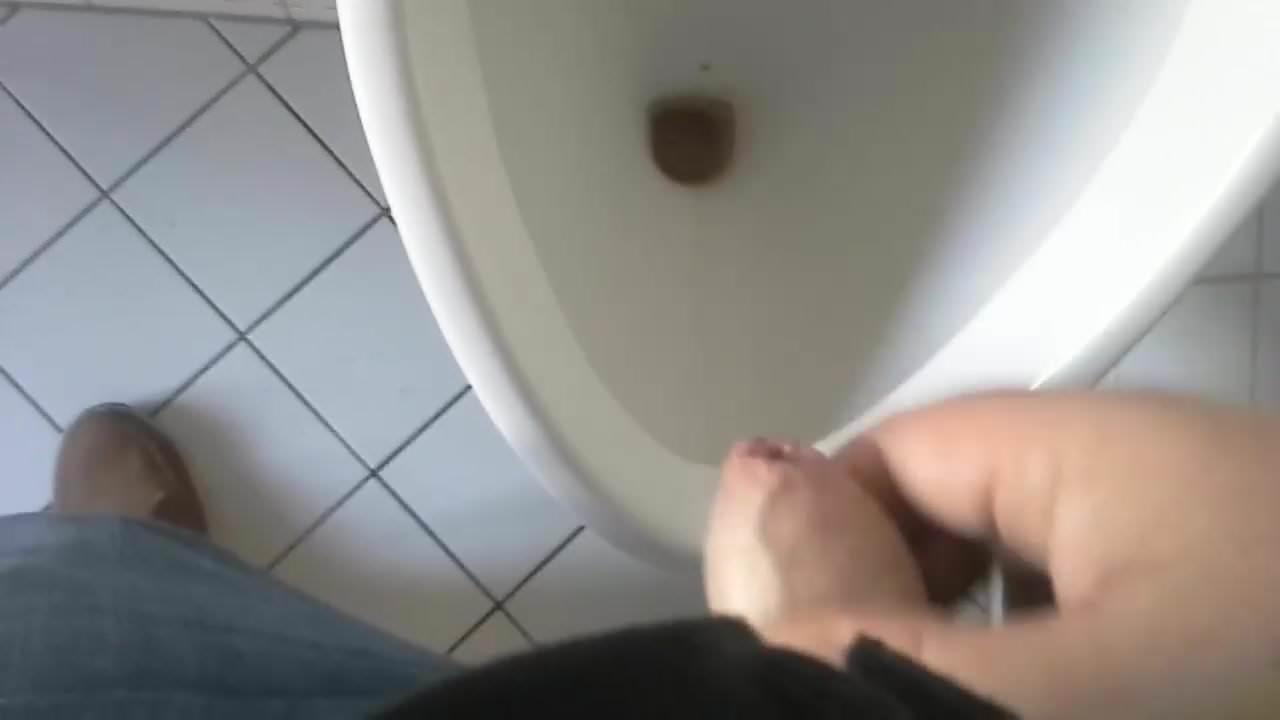 Small erect uncut willy wanked to climax at a urinal