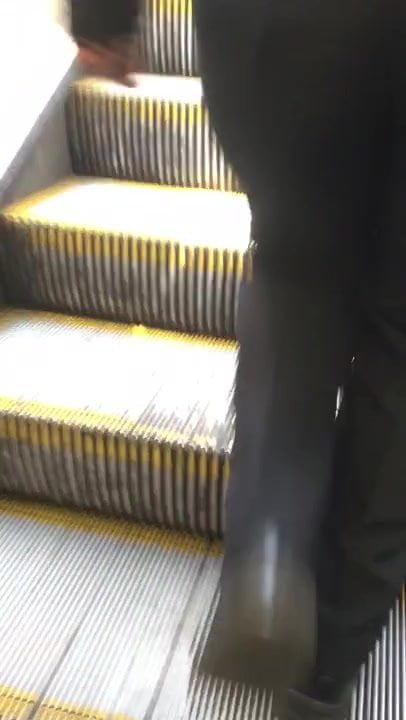 Nice booty milf walking up escalator 
