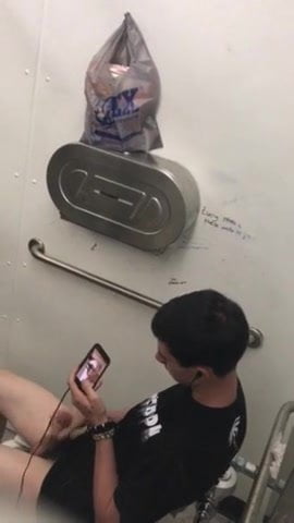 Spying on guy jerking to porn in restroom