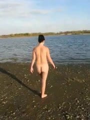 Lili naked on a public beach