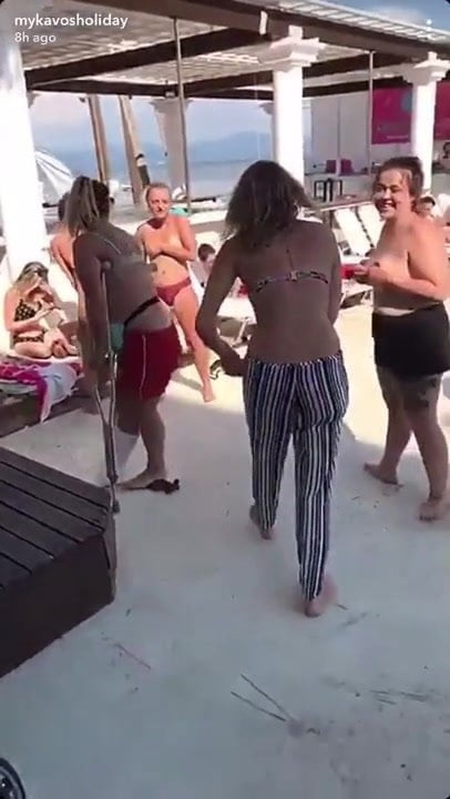 Public stripping game topless in Greece 