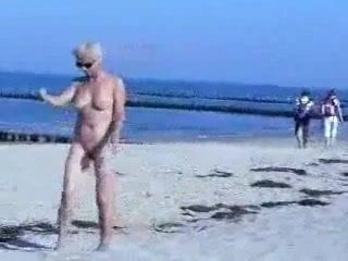 Cute hot granny fully naked at beach. Public nudity