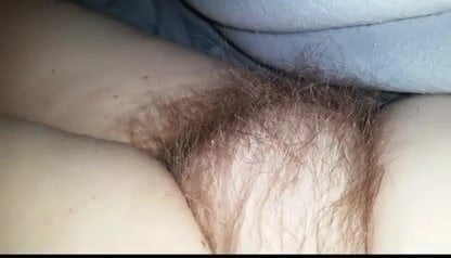 closeup of the wifes soft hairy pussy under the sheets