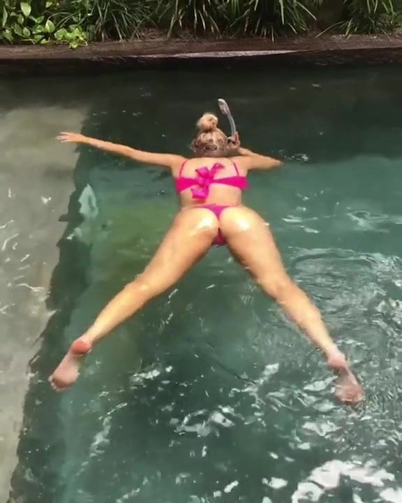 Violet Benson floating in thong bikini 