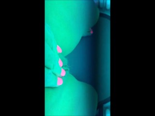 Fingering my pussy on the sunbed tanning milf